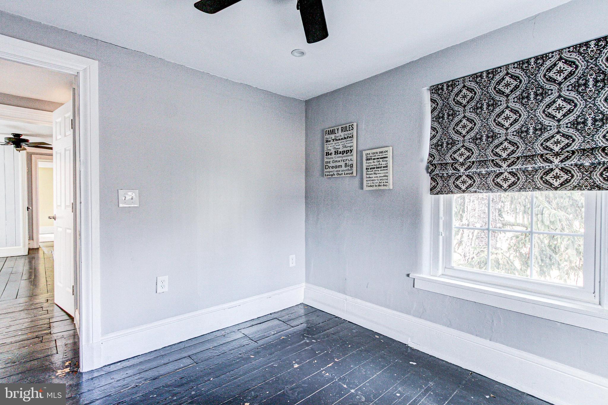 1079 Old Skippack Road Harleysville, PA 19438 - Photo 43 of 53 wooden floor in an empty room with a window