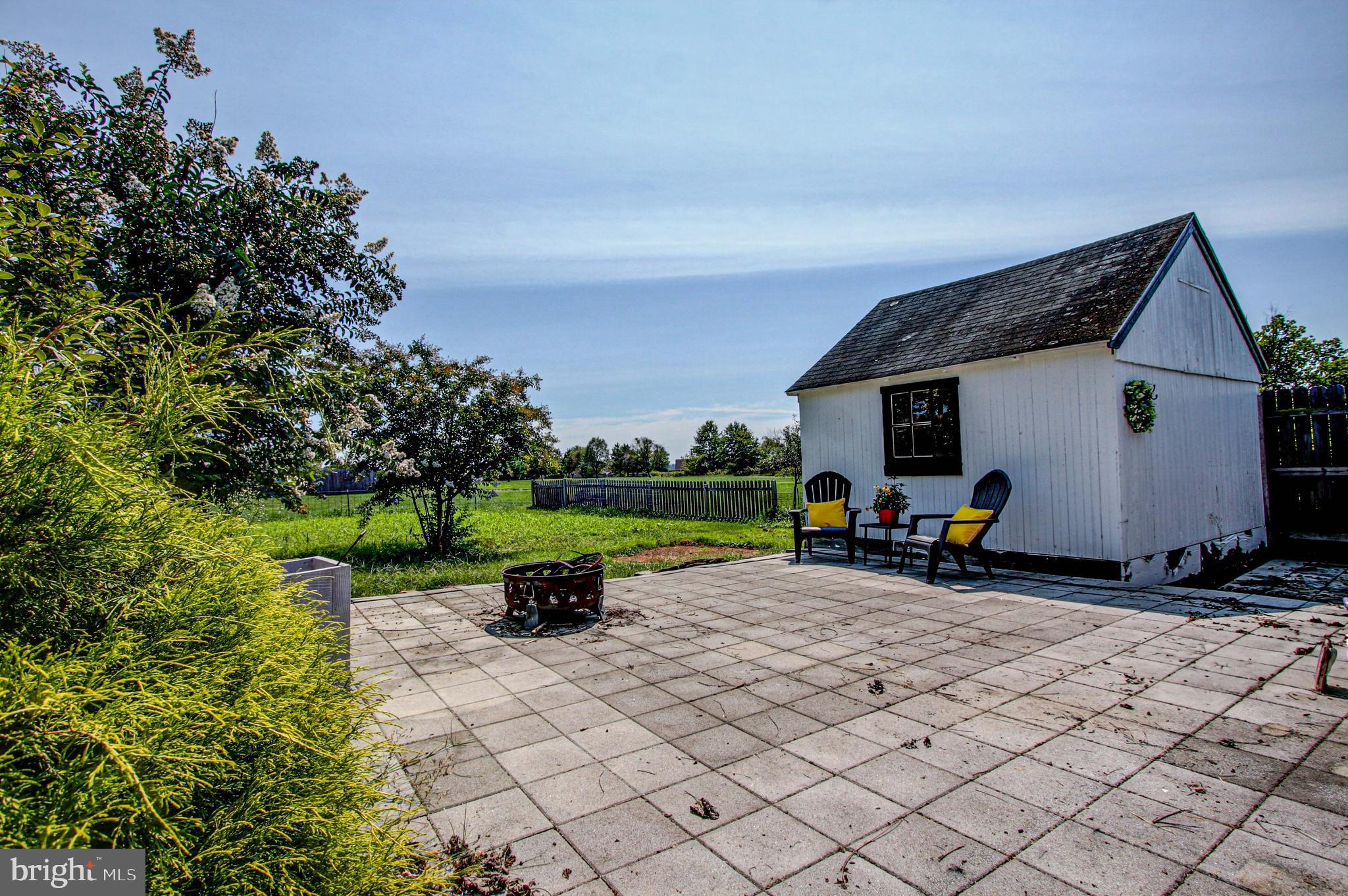 1079 Old Skippack Road Harleysville, PA 19438 - Photo 45 of 53 a view of a house with backyard sitting area and garden