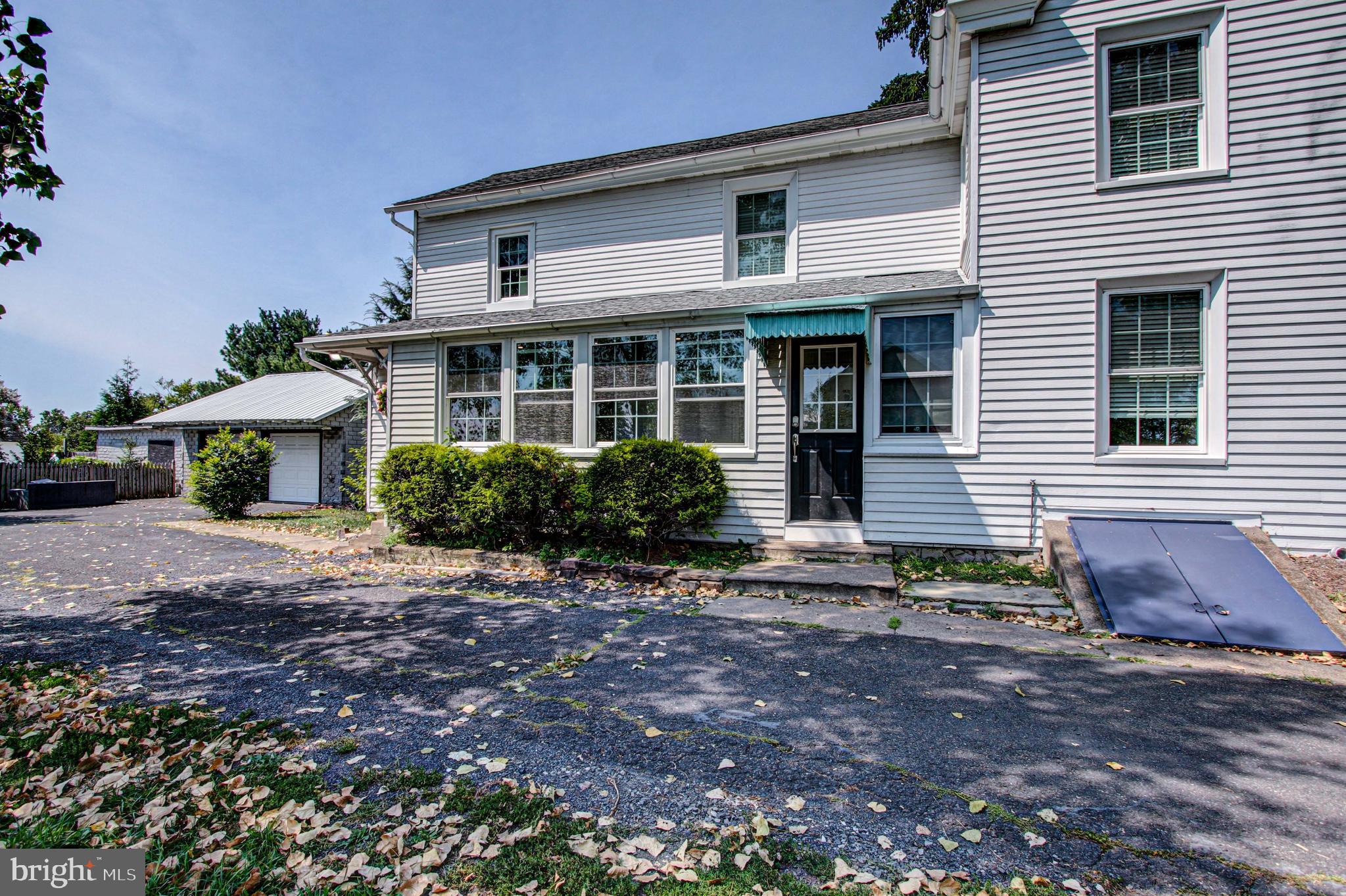 1079 Old Skippack Road Harleysville, PA 19438 - Photo 49 of 53 a front view of a house with garden
