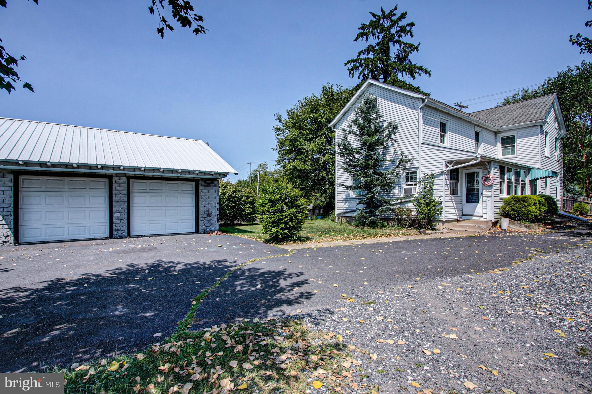 1079 Old Skippack Road Harleysville, PA 19438 - Photo 50 of 53 a front view of a house with garden