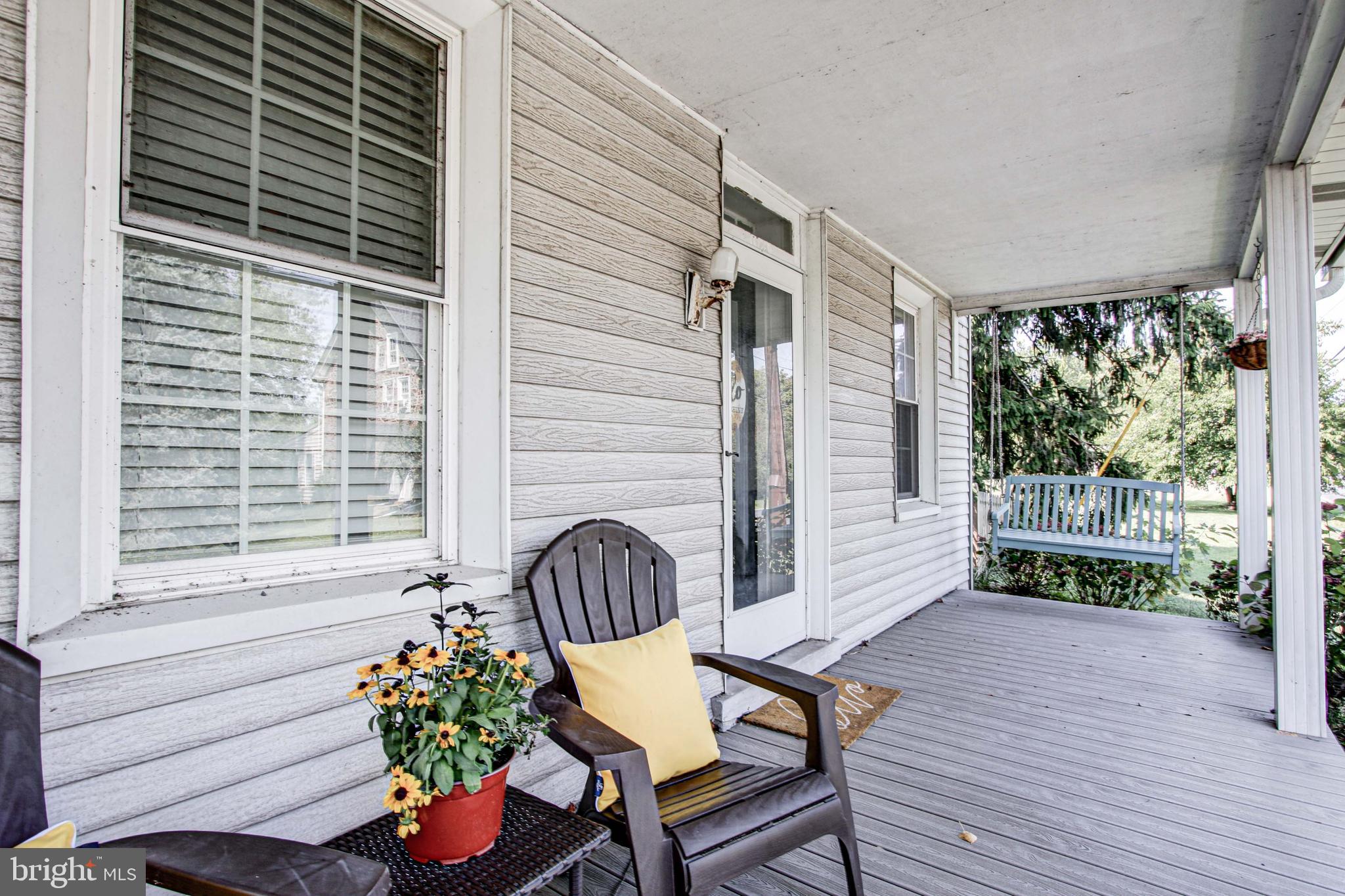 1079 Old Skippack Road Harleysville, PA 19438 - Photo 5 of 53 a view of a porch with furniture and a potted plant