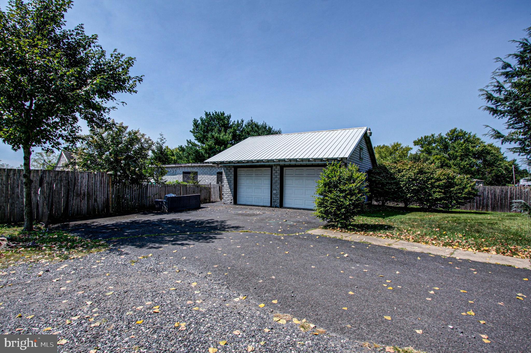 1079 Old Skippack Road Harleysville, PA 19438 - Photo 51 of 53 a front view of a house with a yard and a garage