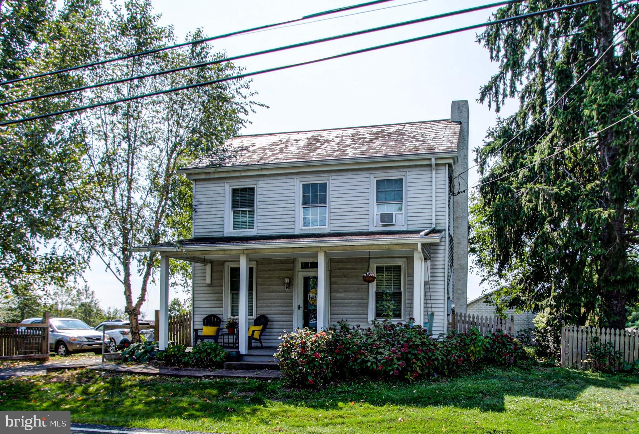 1079 Old Skippack Road Harleysville, PA 19438 - Photo 53 of 53 a view of a house with brick walls and a yard with plants