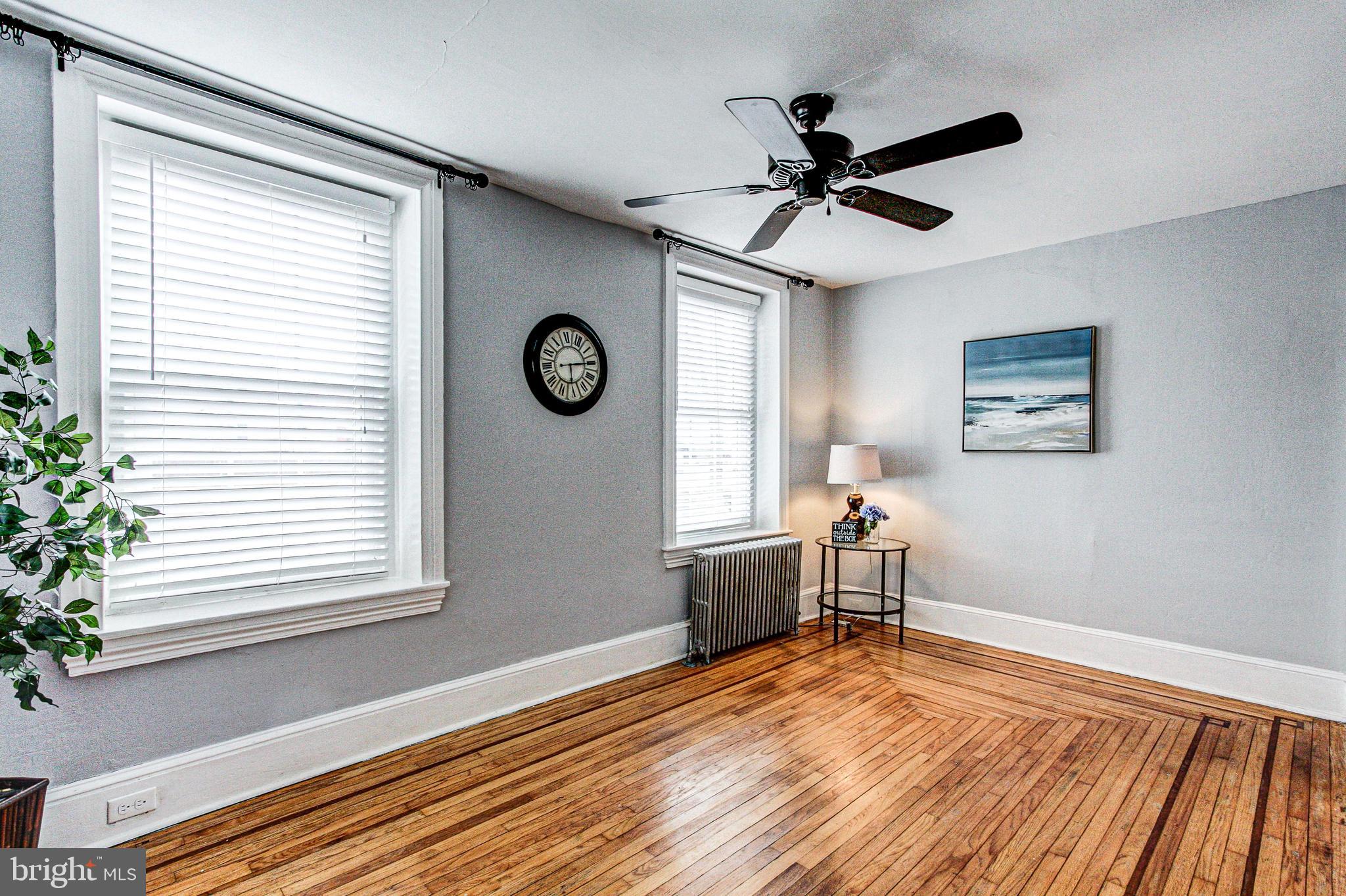 1079 Old Skippack Road Harleysville, PA 19438 - Photo 8 of 53 a view of a livingroom with a window and a ceiling fan