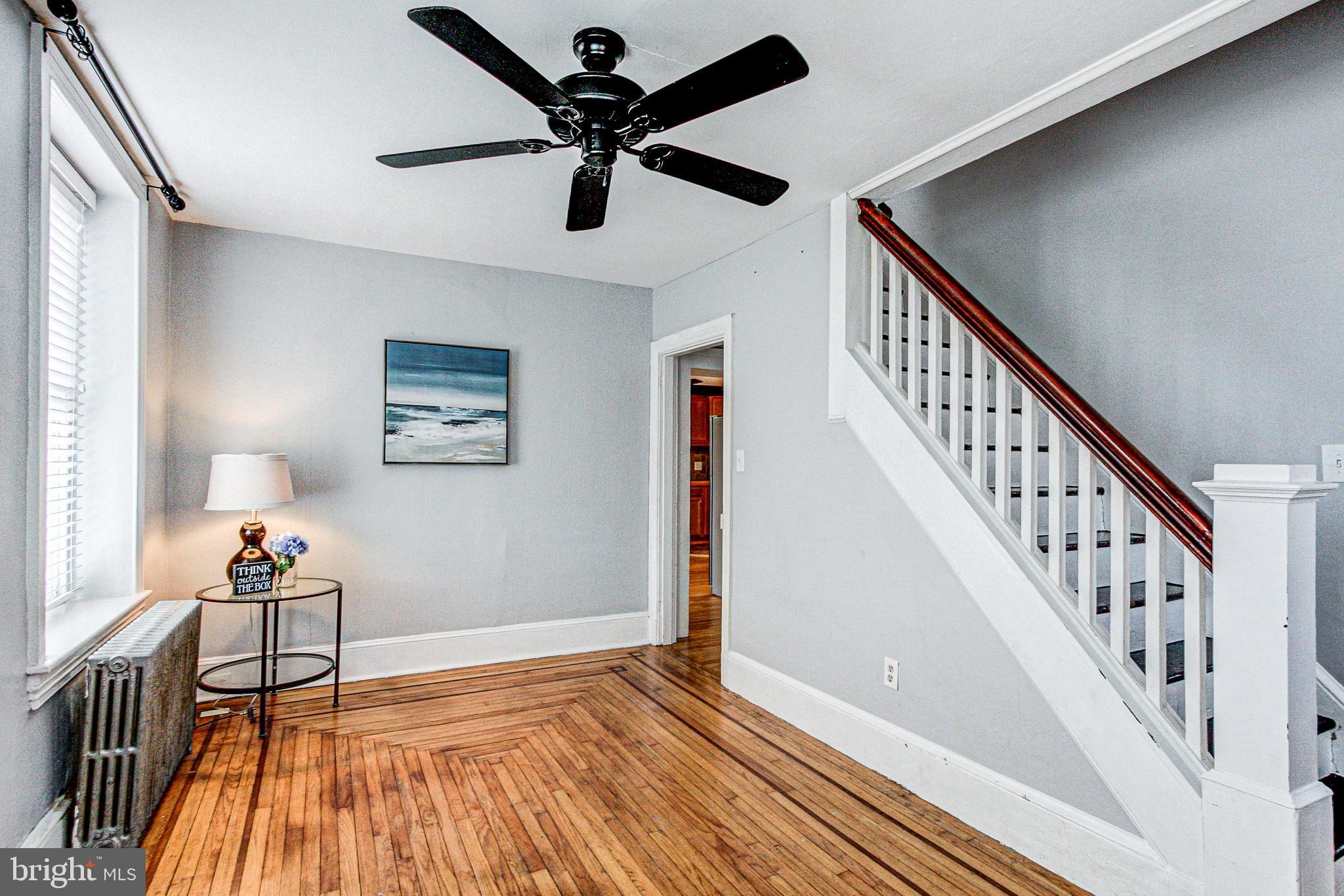 1079 Old Skippack Road Harleysville, PA 19438 - Photo 9 of 53 a view of room with wooden floor and stairs