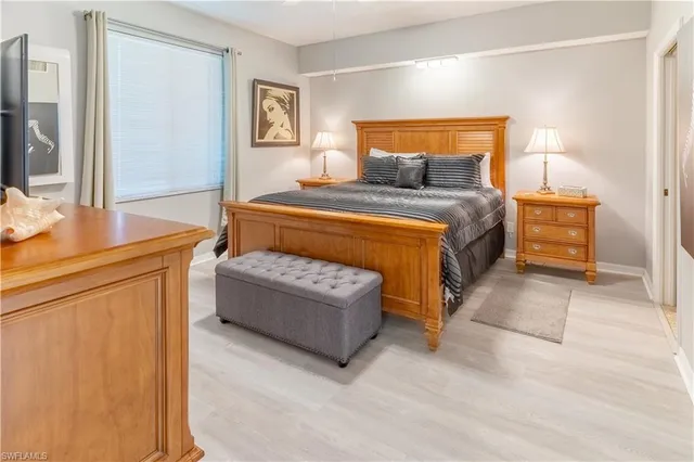 a bedroom with a bed and a cabinets