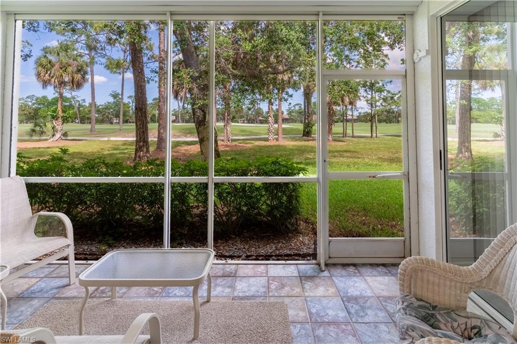 8065 Tiger Cove, Unit 1604 Naples, FL 34113 - Photo 21 of 23 a room with a balcony and furniture