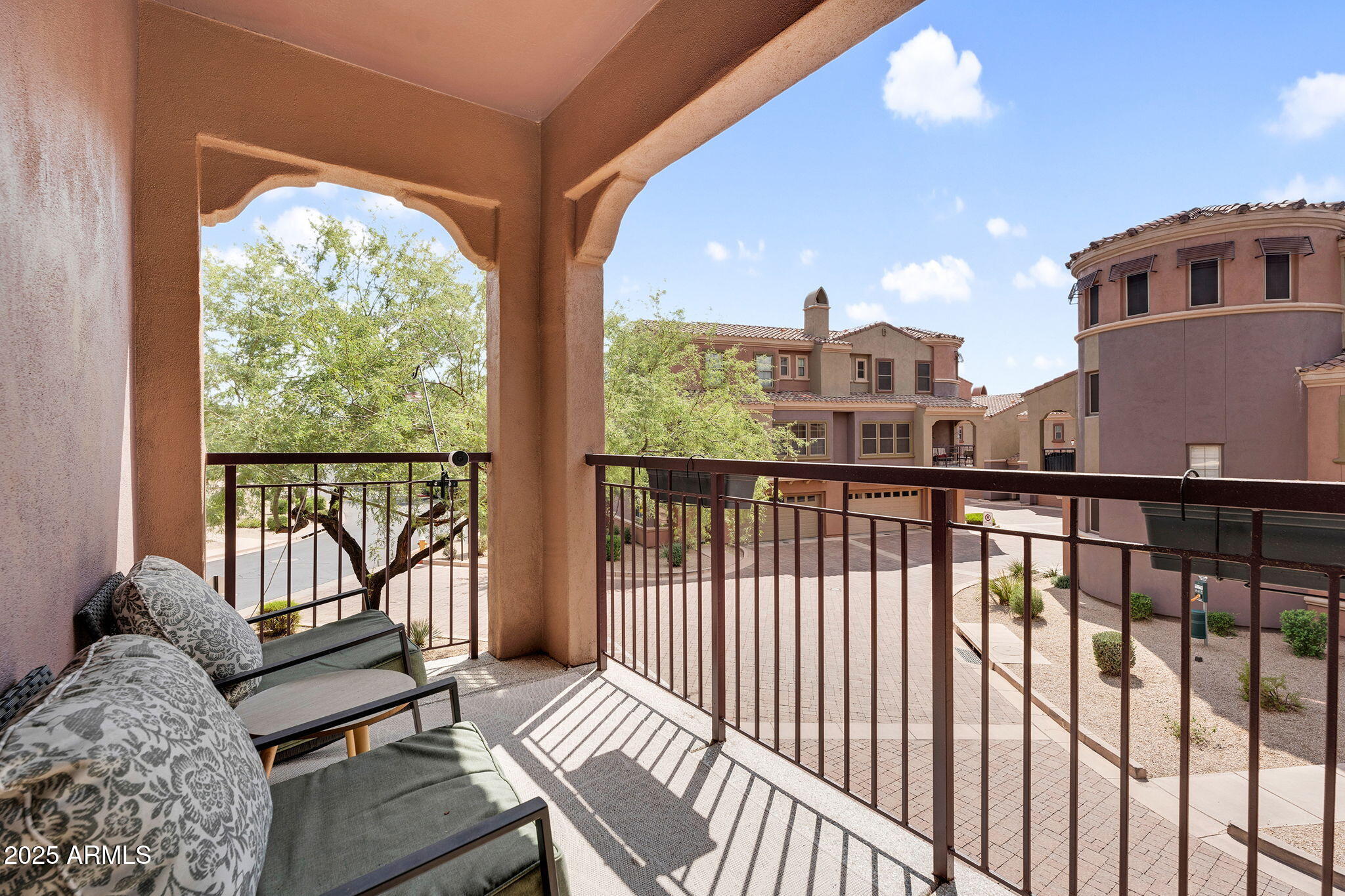3935 East Rough Rider Road, Unit 1057 Phoenix, AZ 85050 - Photo 25 of 41 a view of a porch with furniture and outside view