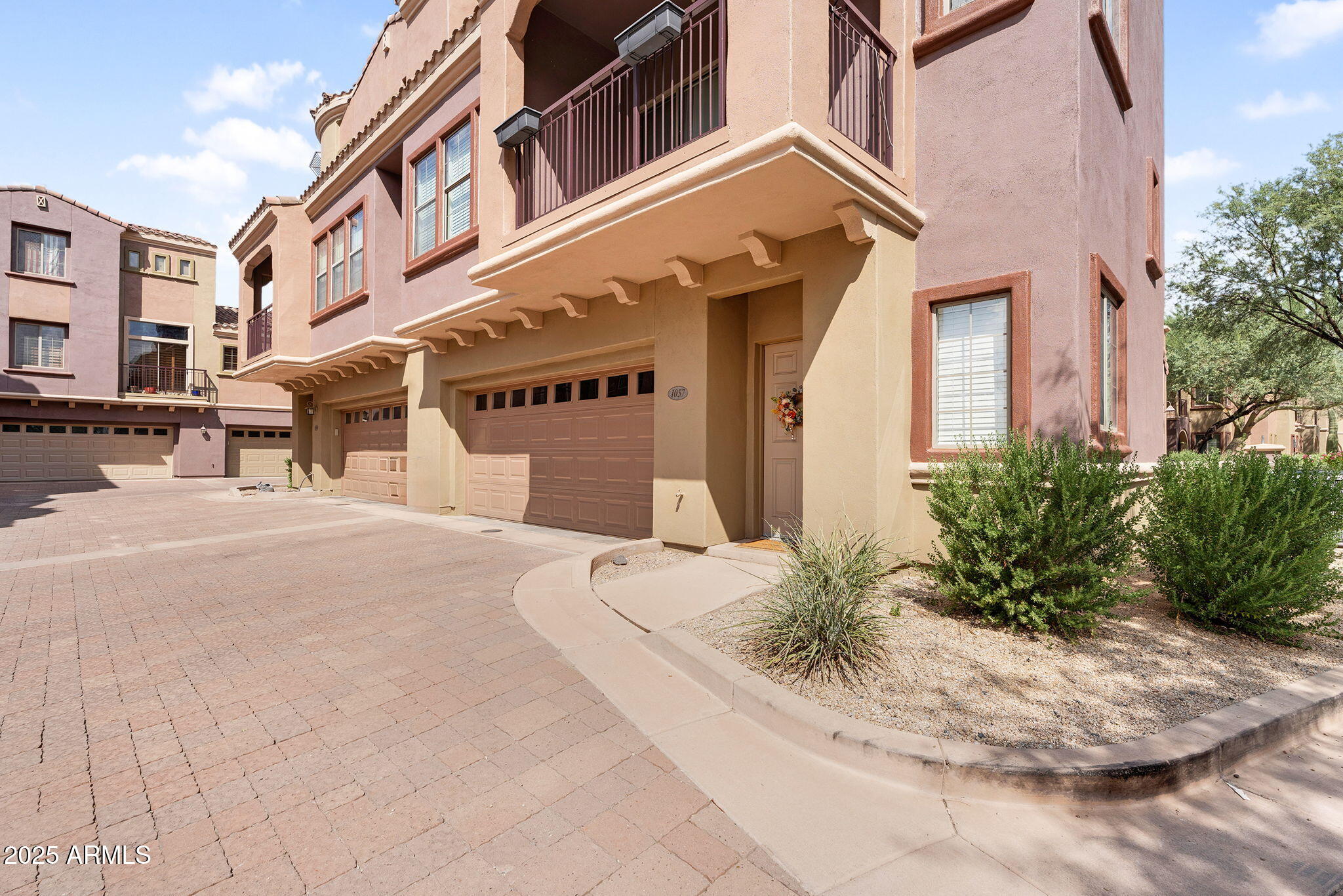 3935 East Rough Rider Road, Unit 1057 Phoenix, AZ 85050 - Photo 2 of 41 a front view of a building
