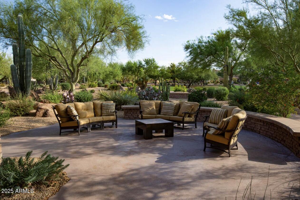 3935 East Rough Rider Road, Unit 1057 Phoenix, AZ 85050 - Photo 35 of 41 a view of a backyard with a patio