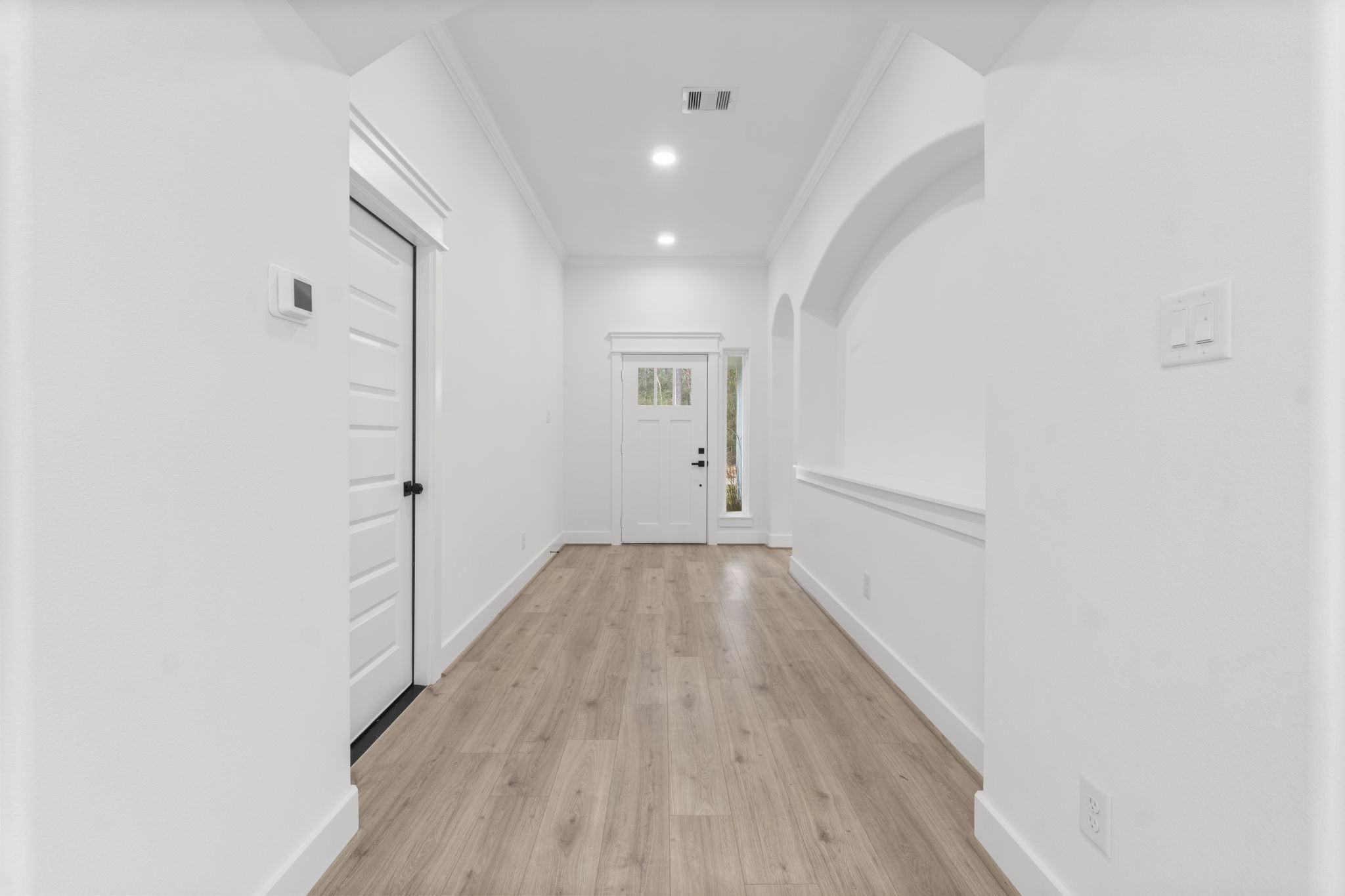 241 Clear Springs Trinity, TX 75862 - Photo 6 of 46 a view of a hallway with wooden floor