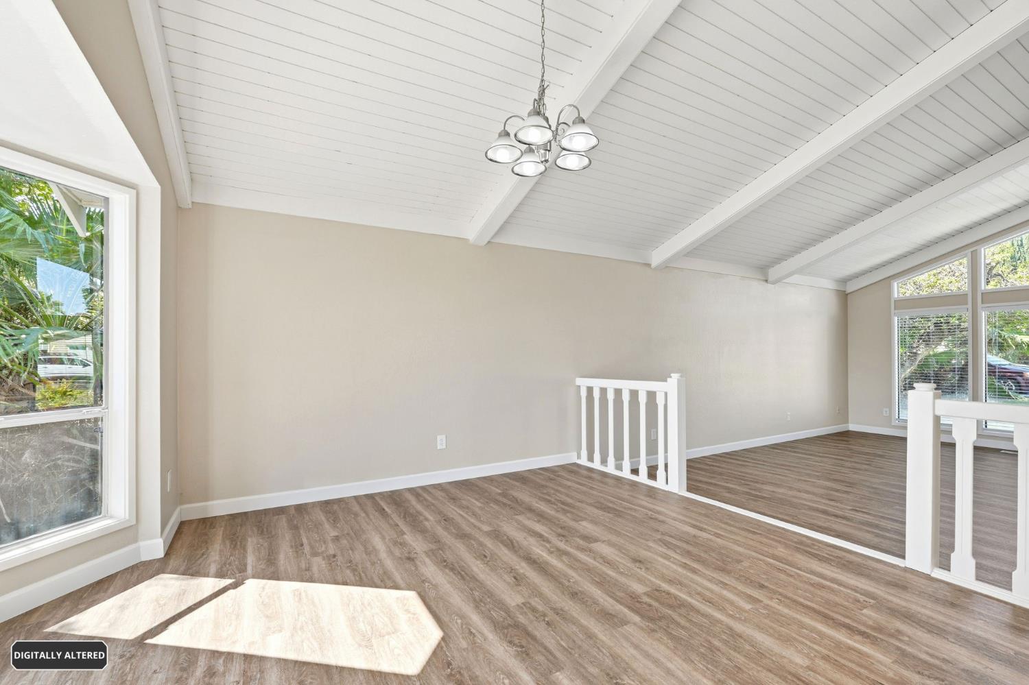 5501 Riverlake Road Discovery Bay, CA 94505 - Photo 17 of 60 a view of an empty room with wooden floor and a window