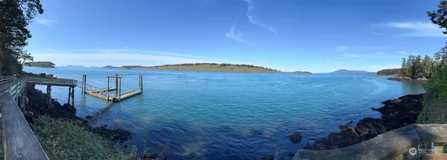 a view of a backyard with sitting area