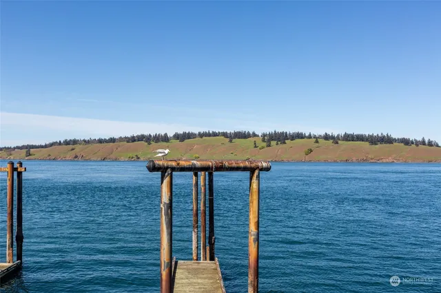 a view of a balcony with wooden floor and city view