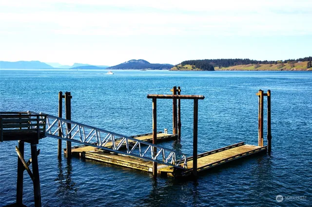 a view of a terrace with lawn chairs