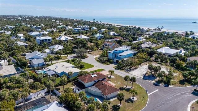 an aerial view of residential houses with outdoor space