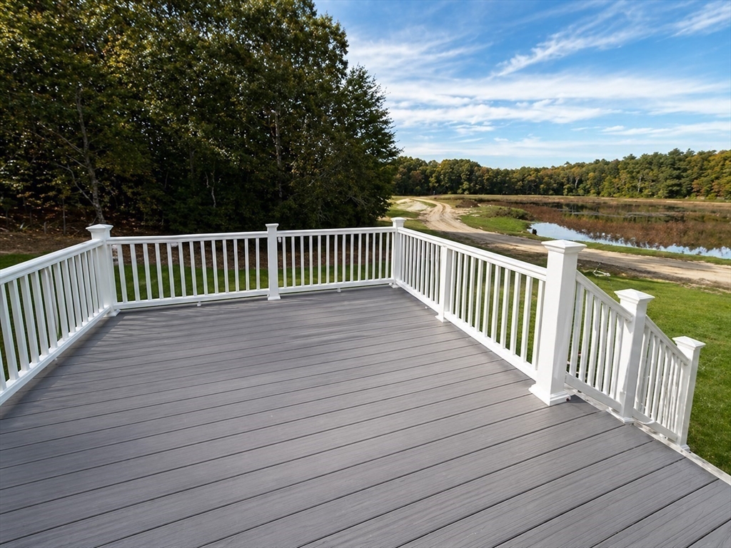 82 Pierce Street Rochester, MA 02770 - Photo 7 of 7 a view of deck and deck with wooden floor and fence