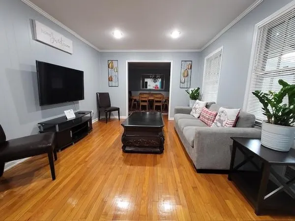a living room with furniture and a flat screen tv