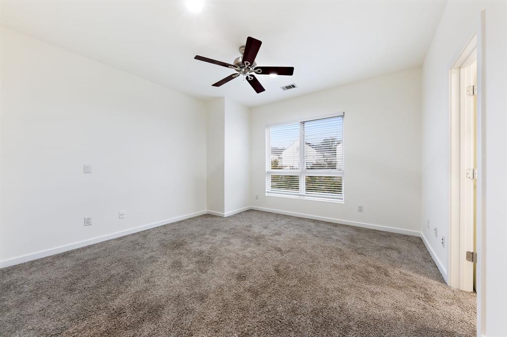 4060 Travis Street, Unit 12 Dallas, TX 75204 - Photo 16 of 20 a view of empty room with windows
