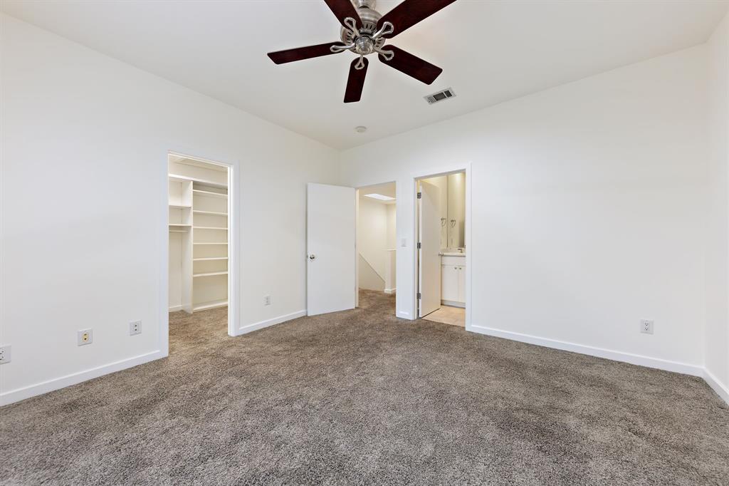 4060 Travis Street, Unit 12 Dallas, TX 75204 - Photo 18 of 20 a view of an empty room and chandelier fan