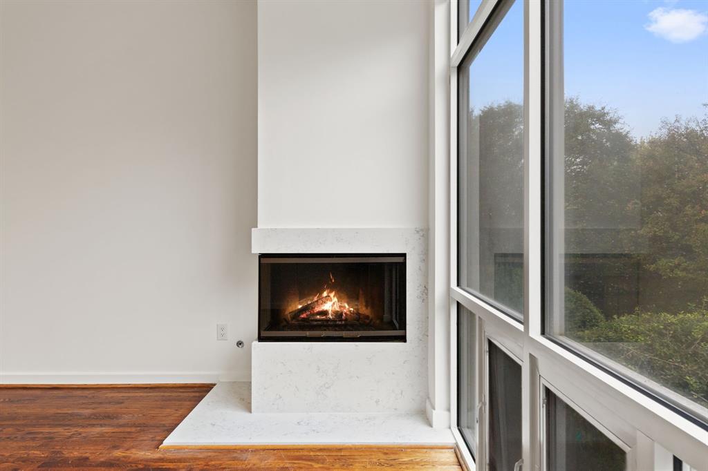 4060 Travis Street, Unit 12 Dallas, TX 75204 - Photo 10 of 20 a view of a living room with a fireplace
