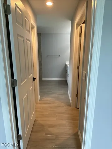 a view of a bathroom from a hallway