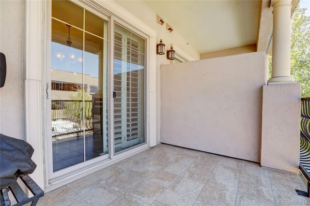 a city street filled with lots of traffic and tall buildings