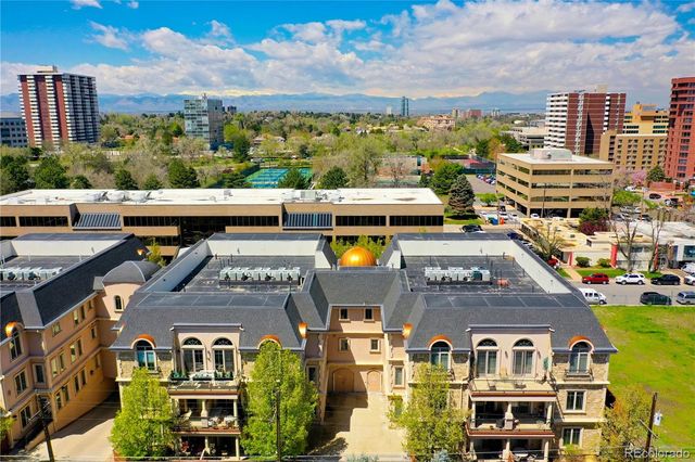 a building with trees in front of it