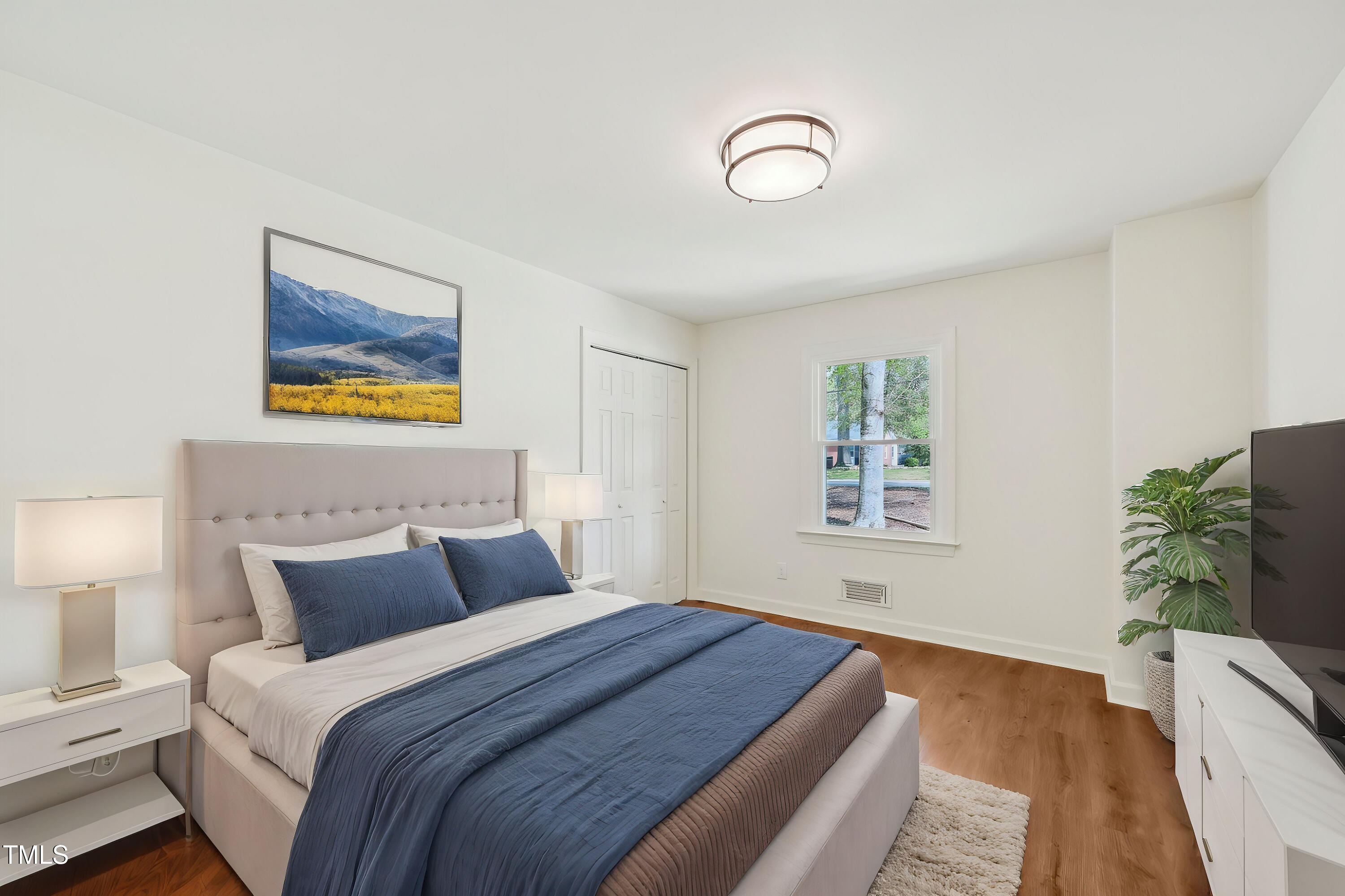 4815 Oak Park Road Raleigh, NC 27612 - Photo 29 of 50 a bedroom with bed and window