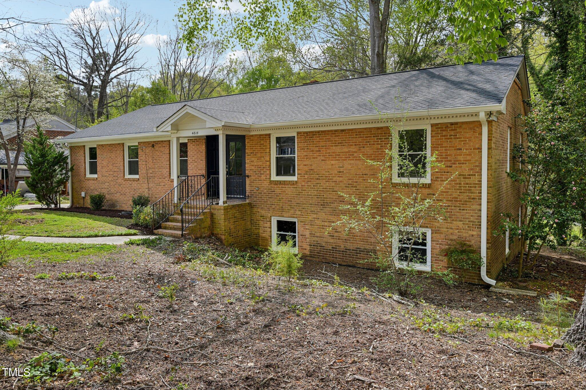 4815 Oak Park Road Raleigh, NC 27612 - Photo 4 of 50 a view of a house with a yard