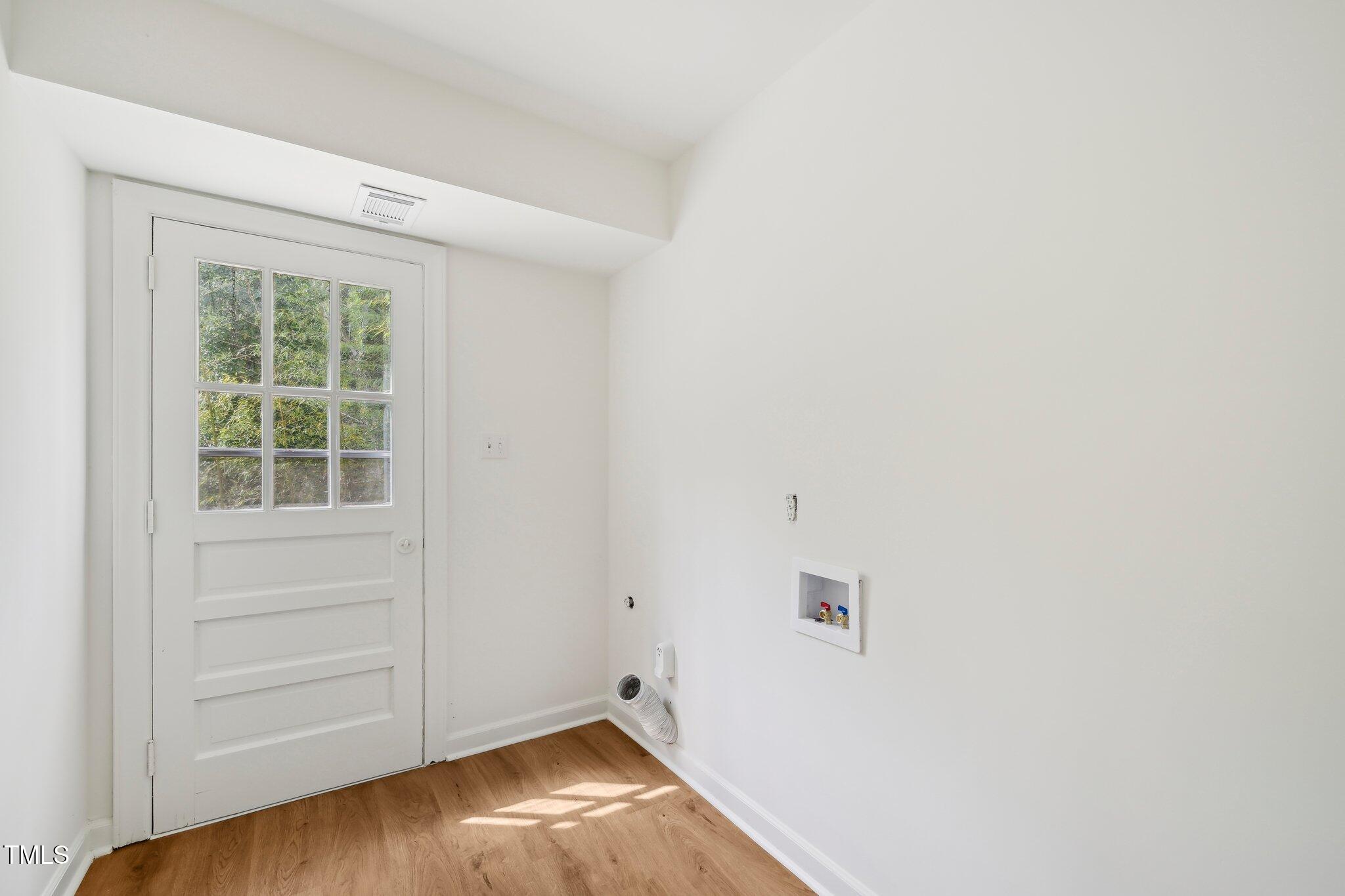4815 Oak Park Road Raleigh, NC 27612 - Photo 43 of 50 an empty room with a hardwood and hallway