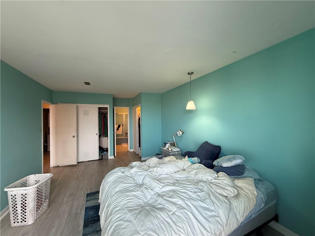 5100 Fifth Avenue, Unit 509 Pittsburgh, PA 15232 - Photo 18 of 26 a bedroom with a bed and window