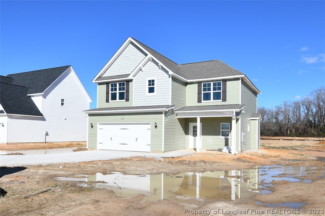 672 Barlow Road Parkton, NC 28371 - Photo 1 of 17 a front view of a house with a yard