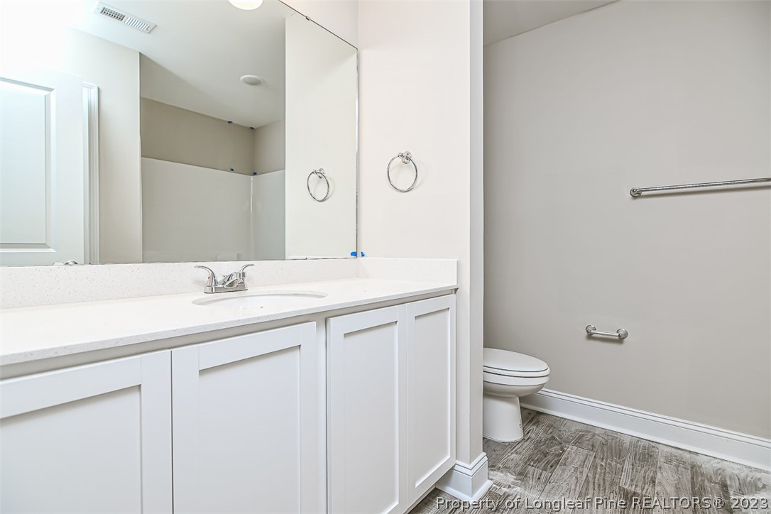 672 Barlow Road Parkton, NC 28371 - Photo 11 of 17 a bathroom with a sink and a mirror