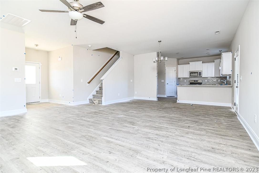 672 Barlow Road Parkton, NC 28371 - Photo 3 of 17 a view of a kitchen with a sink and a stove top oven