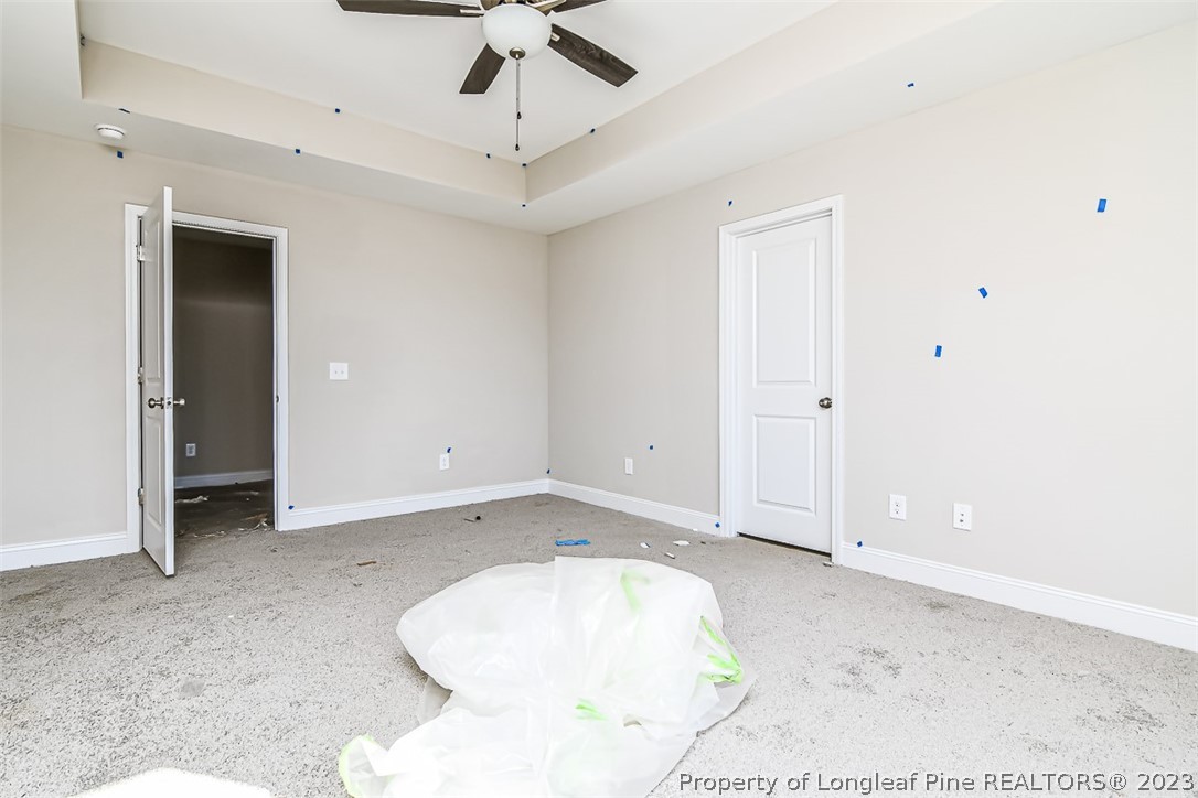 672 Barlow Road Parkton, NC 28371 - Photo 7 of 17 en empty room with wooden floor and fan