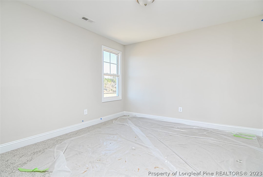 672 Barlow Road Parkton, NC 28371 - Photo 10 of 17 an empty room with windows