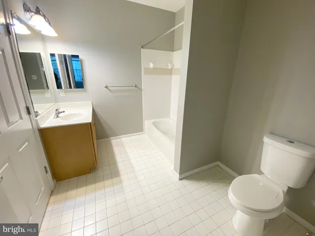 a bathroom with a sink and toilet