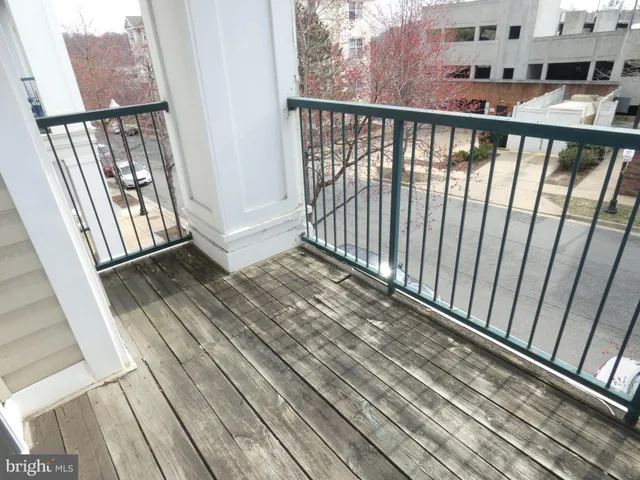a view of balcony with wooden floor