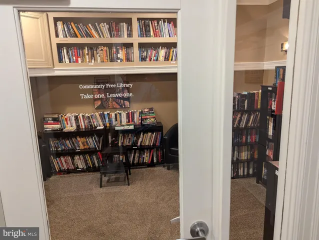 a dining room with furniture and a book shelf