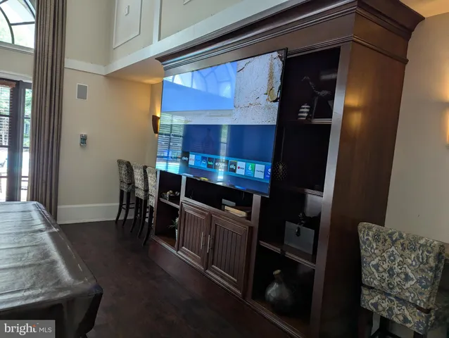 a view of kitchen and dining room with wooden floor