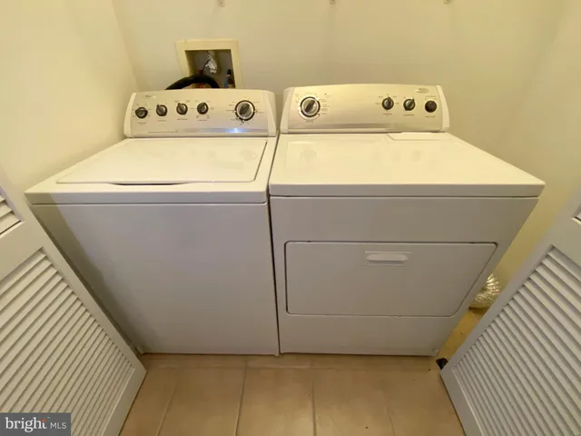 a utility room with washer and dryer