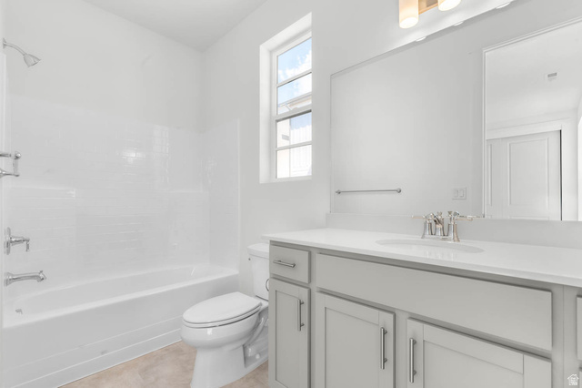 3204 West 1570 North Provo, UT 84601 - Photo 9 of 19 Bathroom featuring vanity, shower / bathtub combination, and light tile patterned flooring
