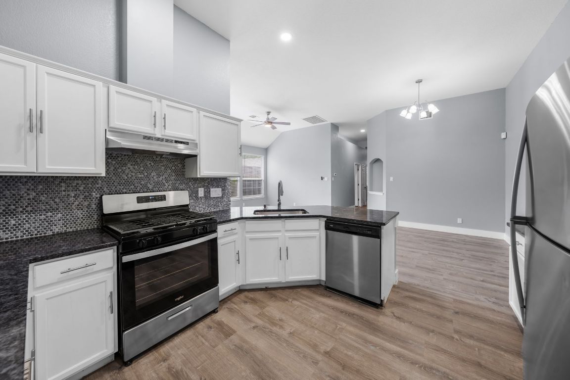 1214 Vargas Road, Unit B Austin, TX 78741 - Photo 10 of 25 a kitchen with a stove and a sink