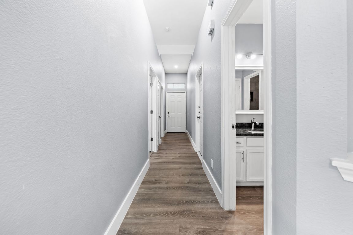 1214 Vargas Road, Unit B Austin, TX 78741 - Photo 20 of 25 a view of a hallway with wooden floor