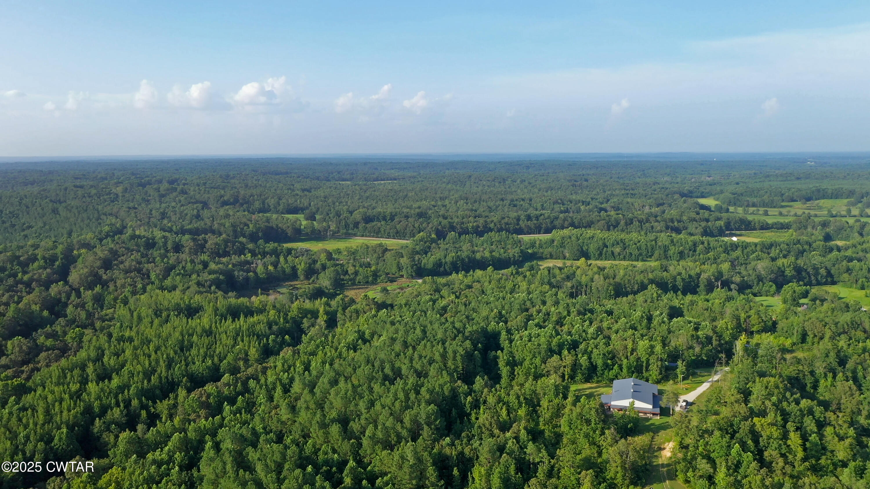 0 Roberts Road Pinson, TN 38366 - Photo 9 of 14 a view of a field of grass and trees
