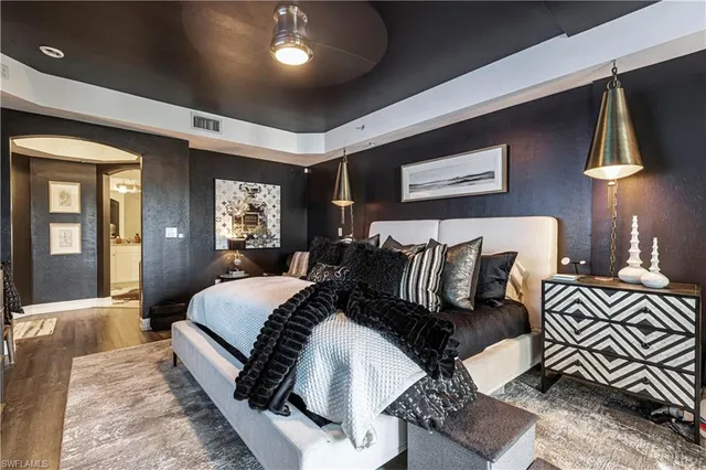 a bed room with bed and a night stand