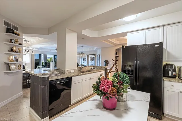 a kitchen with a stove and refrigerator