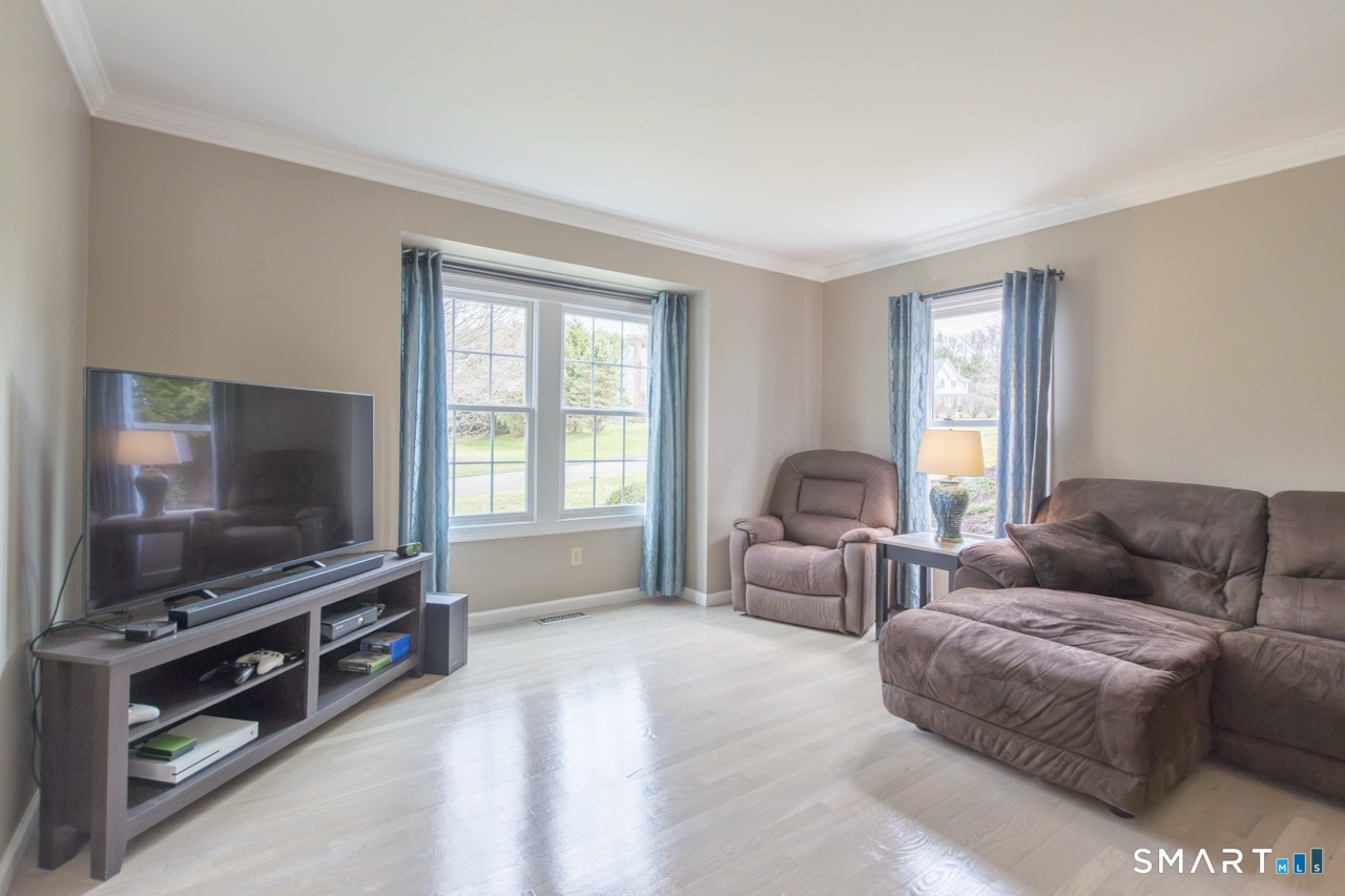 16 Shadowood Lane Trumbull, CT 06611 - Photo 14 of 39 a living room with furniture and a flat screen tv