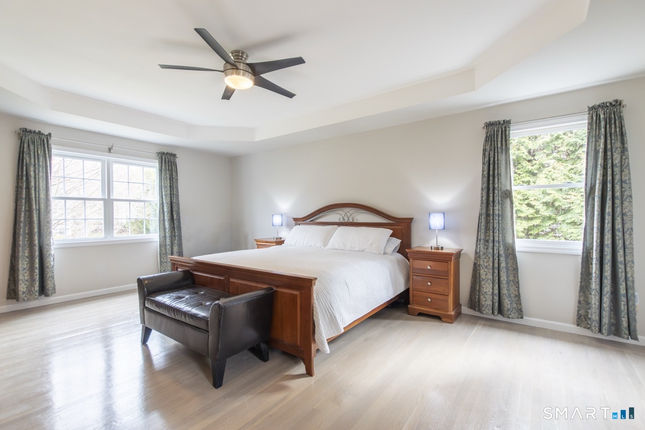 16 Shadowood Lane Trumbull, CT 06611 - Photo 17 of 39 a bedroom with a bed and a window
